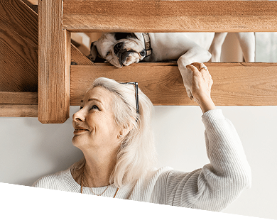 Woman with dog on ladder
