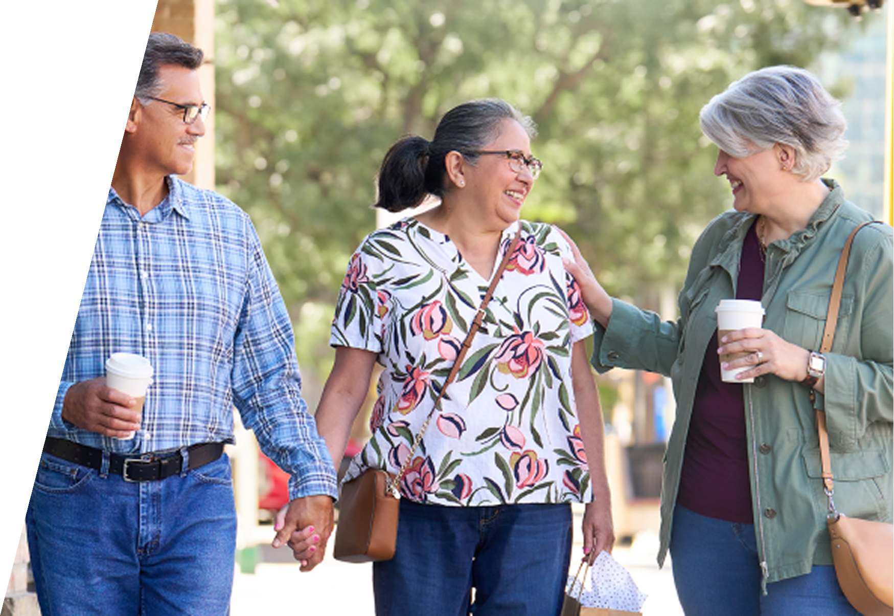 Three adults walking outdoors